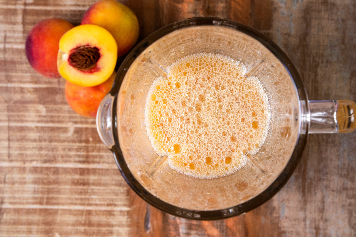 Fresh peaches blended with water and thyme for Peach Thyme Stacked Water recipe