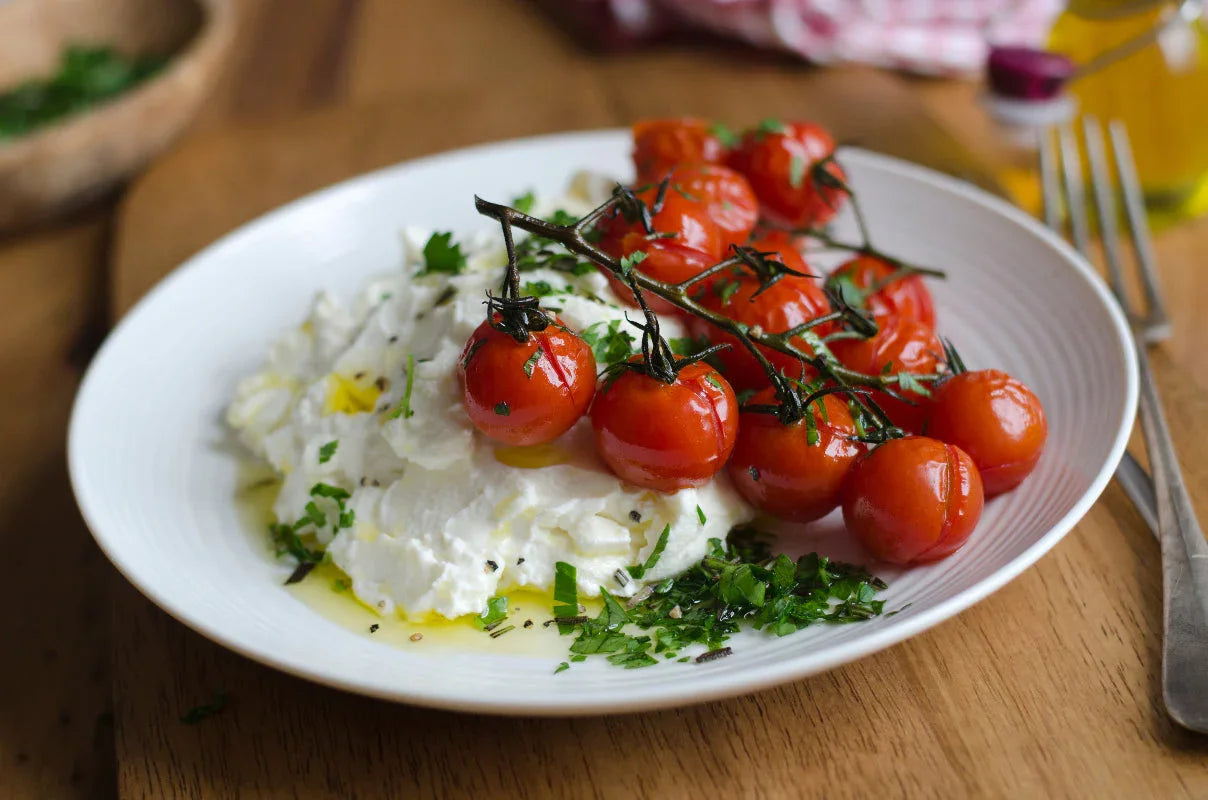 Whipped ricotta topped with roasted cherry tomatoes, hot honey, basil, parsley, and olive oil served with toasted sourdough.